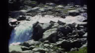 Alaska USA (1977): A View Of Waterfalls Flowing Through The Broken Pieces Of Rock