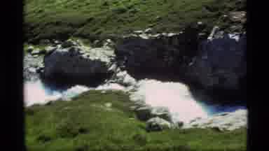 Alaska USA (1977): A Beautiful Scene Of Waterfalls Flowing Through The Rocky