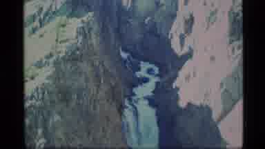 Alaska USA (1977): Cool Waterfall Nestled Between Rock Formations And A Beautiful