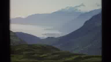 Alaska USA-1977: Green Hillside Nestled Inside The Tall Mountains Surrounded By