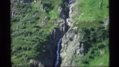 Alaska USA (1977): A Stream Flowing Down The Side Of A Mountain Through The Rocks
