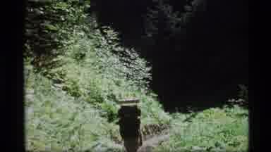Alaska USA (1977): Guy Hiking With Backpack And Referencing A Map