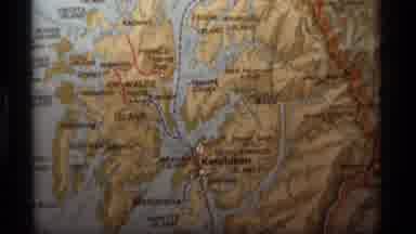 Alaska USA (1977): A Zoom In Of A Place On A Physical Globe Then A Video Of A Boat
