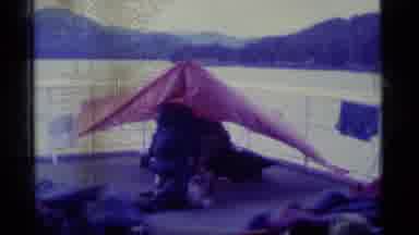Alaska USA (1977): Many People On Boat Deck Windy Day Middle Of Lake Surrounded By