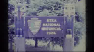 Alaska USA-1977: Sitka National Historical Park With Totem Poles And Forested Shoreline