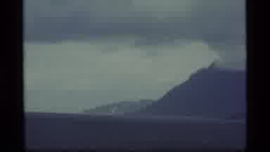 Alaska USA (1977): Beautiful Volcano-Shaped Mountain Surrounded By Mist And A Lake