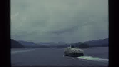 Alaska USA (1977): A Large Boat Progresses Though Waters With Beautiful
