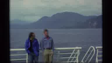 Alaska USA (1977): People On A Ship In The Water Surrounded By Mountains