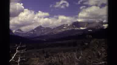 Canada (1979): Tracking Shot Of Beautiful Mountains On A Sunny Day With Partial