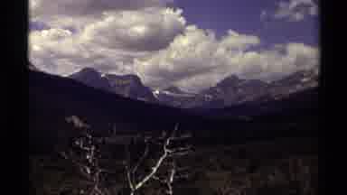 Canada (1979): Cloudy Blue Sky Over Multiple Mountains