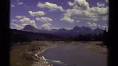 Canada (1979): A Wild Blue River That Goes In The Forest In A Cloudy Day