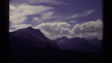Canada (1979): Clear Blue Sky Full With White Clouds Over A Mountain Range