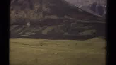 Canada (1979): Open Green Field Showing A Valley Backdrop And Clear Sky