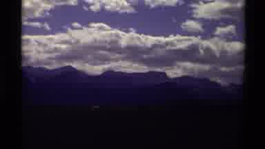 Canada (1979): Landscape Dark Mountains With Blue Sky And Puffy White Clouds On