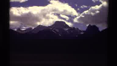 Canada (1979): Cars Driving Through A Mountainous Region And Another Shot Of The