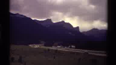 Canada (1979): Cars Driving On Road Near Mountain Range