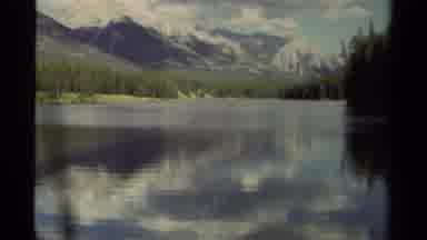 Canada (1979): Clouds Looming Over Mountains And Lake During A Beautiful Cloudy