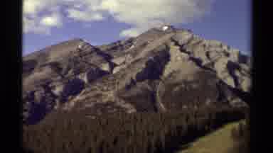 Canada (1979): Beautiful Shot Of The Mountains With Forest Trees Below And Blue