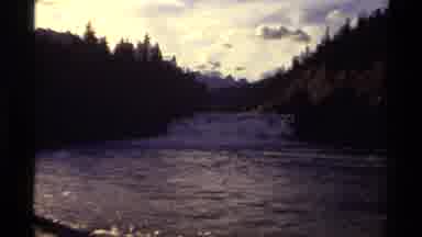 Canada (1979): River Is Flowing Amid Forest On The Valley Of A Large Mountain Peak