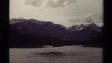 Canada (1979): A View Of Big Mountain Peaks Surrounded By Water