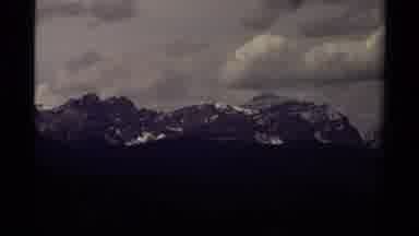 Canada (1979): Video Of Snow Covered Mountains With A Sky Full Of Clouds