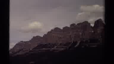 Canada (1979): Different Mountain Ranges Nestled Between Big White Fluffy Clouds