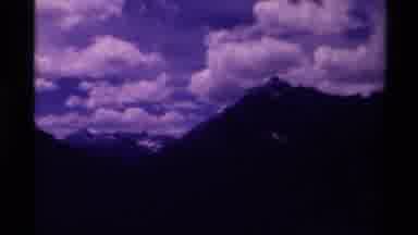 Canada (1979): Big White Clouds Take Over The Sky Above Mountain Tops