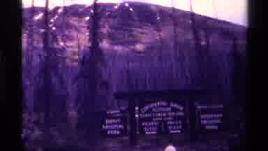 Canada (1979): Slowing Moving Image From Top To Bottom Over A Sign Composed Of The