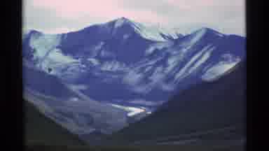 Alaska USA (1977): Some People Are Walking In The Vast Valley Of A Larger Mountain