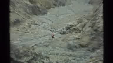 Alaska USA (1977): Hikers Going Up A Mountain Pass In A Barren Landscape