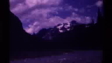 Canada (1979): A Dark Gloomy Mountain Top Surrounded By Big Clouds