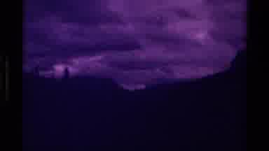 Canada (1979): A Dark Video Of Scenery Containing Shadows Of Trees And Mountains