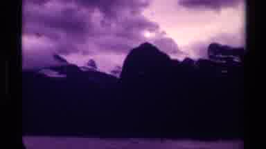 Canada (1979): Different Angles Of Purple Mountains Covered In Snow With Clouds