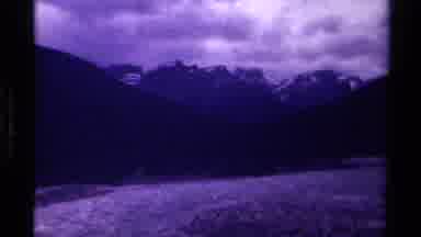 Canada (1979): A Scary Mountain A Long River And A Lonely Man Showing A Dark Sky