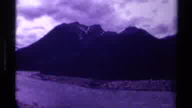 Canada (1979): Dark Video Of A Road And Grass And Trees Behind It