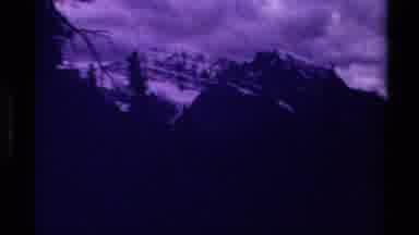 Canada (1979): Dark Foreboding Shots Of Mountainous Terrain With A Cloudy Sky