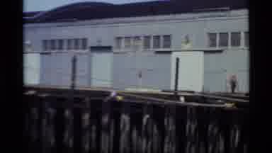 Alaska USA-1977: A View Of A Big Cruise Ship And A Man Working Behind Scenes