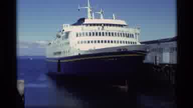 Alaska USA-1977: Large Ferry Columbia Docked At Pier On Calm Bay