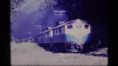 Alaska USA (1977): A Scene Of A Big Train Riding Fast On The Railroad Tracks