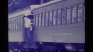 Alaska USA (1977): A View Of A Train With Man Standing In The Middle Section Of It