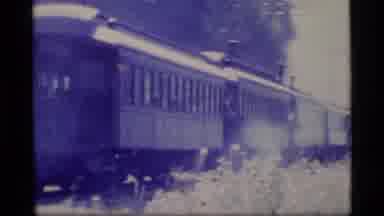 Alaska USA (1977): Train Riding Showing Town People Walking