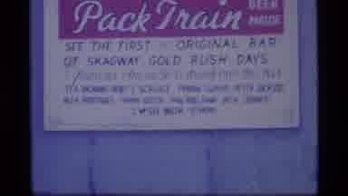 Alaska USA (1977): Antlers On Yellow Display Board And A Red Yellow Pack Train