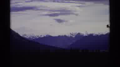 Alaska USA (1977): Soft White Clouds Overlooking A Snow-Capped Mountain Surrounded