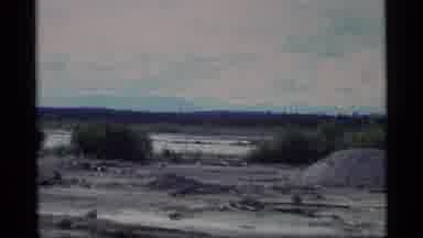 Alaska USA (1977): View Of Snow Covered Mountain Slopes Trees And Barren Field On