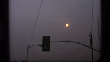 Alaska USA (1977): Cars Drive Past Stream As Modern Man Made City Meets Nature