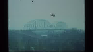 Alaska USA (1977): A View Of A Town's Dirty Water And Bridge
