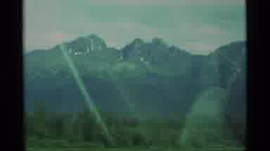 Alaska USA (1977): Driving Alongside A Shimmering Lake With An Impressive Mountain