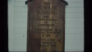Alaska USA (1977): Two Different Plaques Proclaiming The Name Of Their Building In