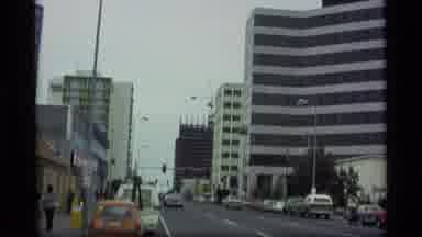 Alaska USA (1977): A Fairly Busy City Setting With Mountains In The Background On