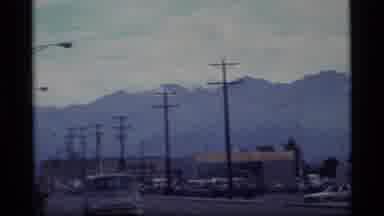 Alaska USA (1977): Mountains From Street With Telephone Poles And Street Lamps;